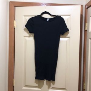 Fitted rib knit black mini dress.